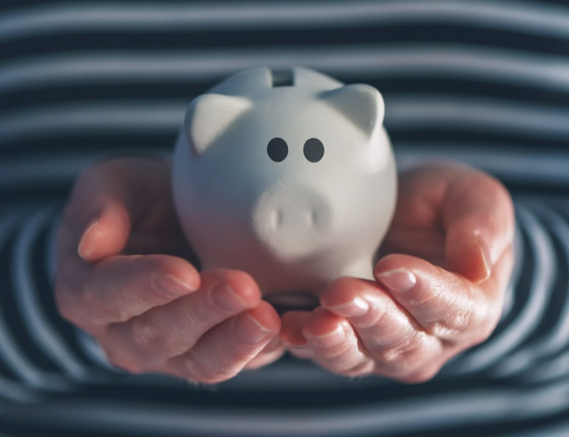 Woman with piggy coin bank