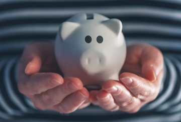 Woman with piggy coin bank