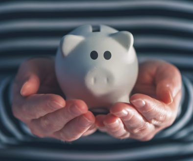 Woman with piggy coin bank