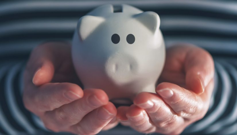 Woman with piggy coin bank